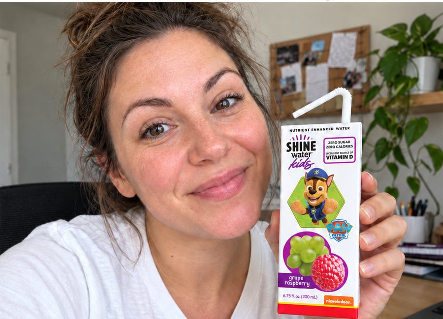 Parent creator holding a ShineWater Kids carton