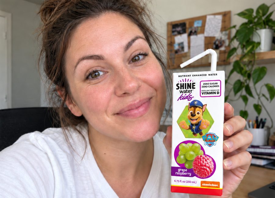 Parent creator holding a ShineWater Kids carton